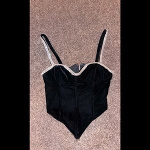 Velvet black AKIRA hanky hem crop top with rhinestone beading.